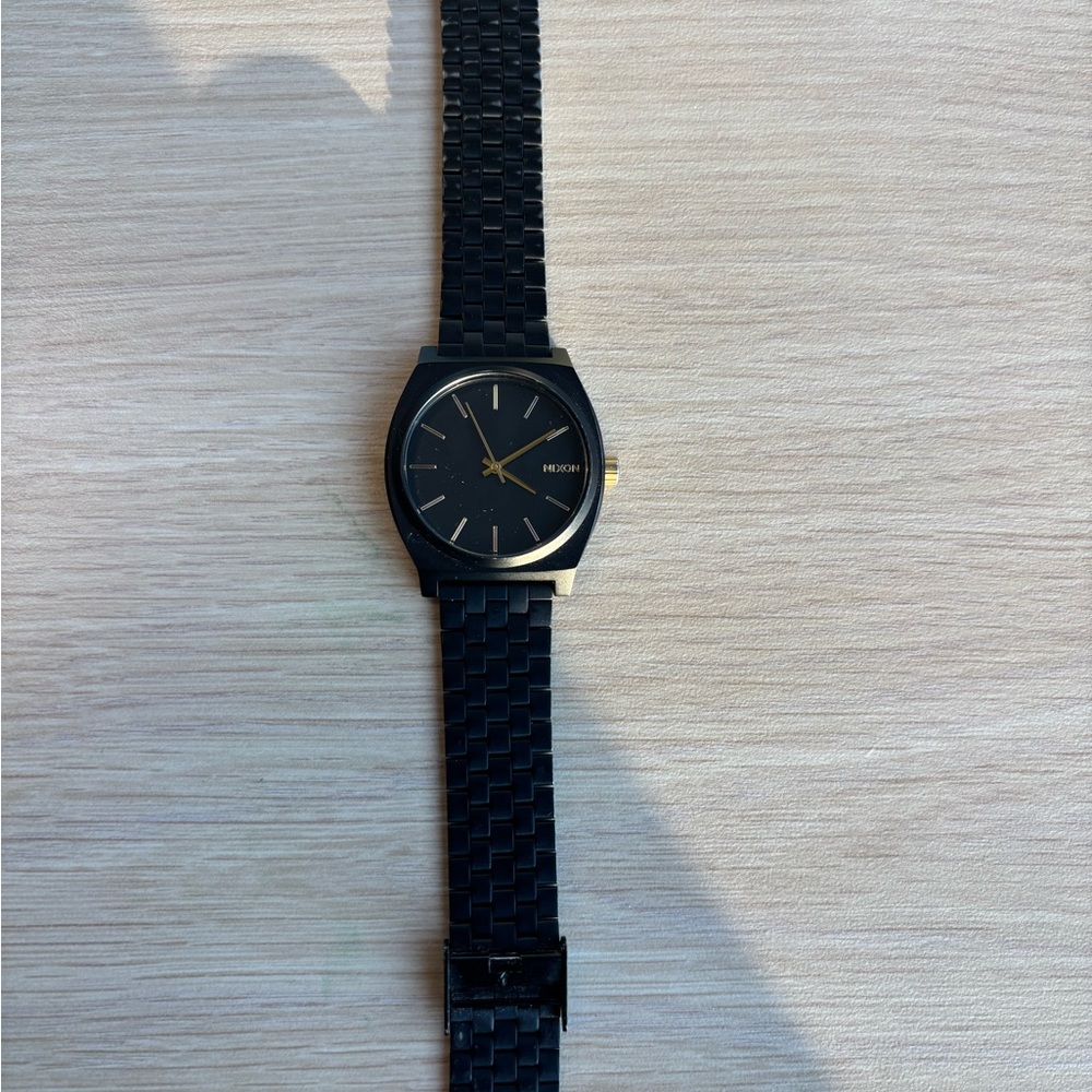 Nixon Black and Gold Men's Timepiece